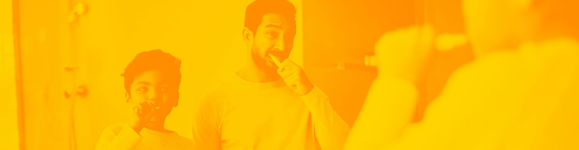 Stylized orange image of father and son brushing their teeth